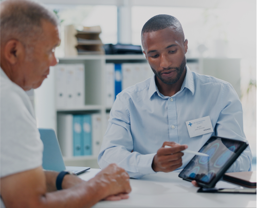 Male representative showing patient a chart