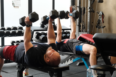 Students weight lifting side by-side.